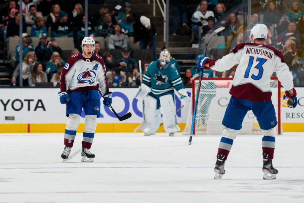Nathan MacKinnon hits 100 points and Avs clinch playoff berth in win over San Jose Sharks