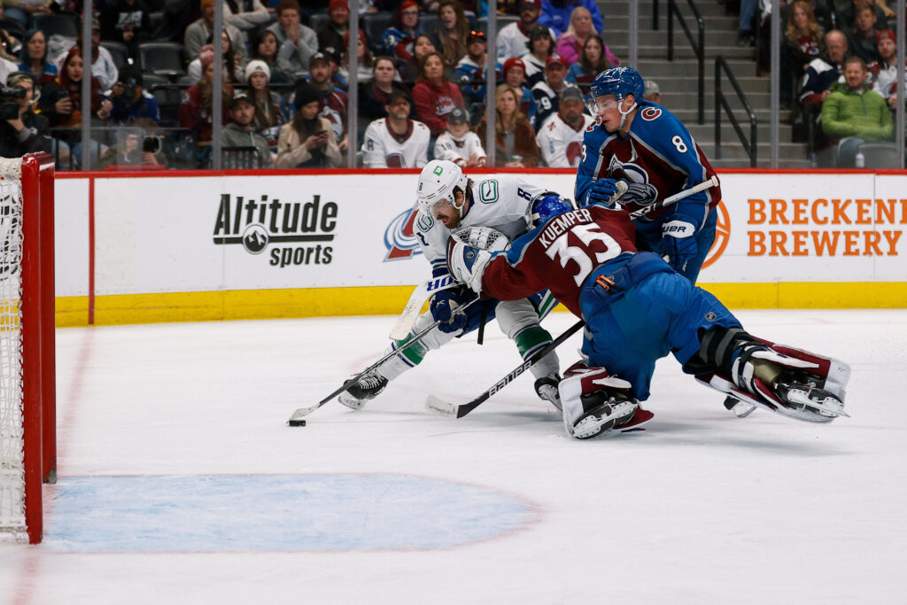 Vancouver slows it down, outlasts Avs in mid-week slog