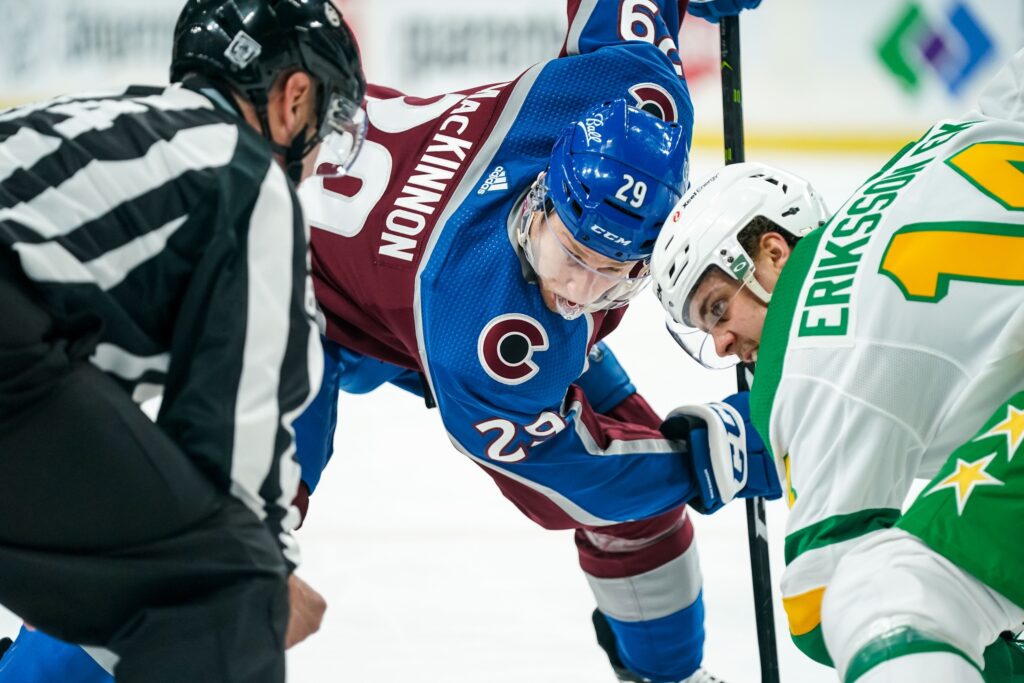 MacKinnon injury overshadows overtime loss in Minnesota