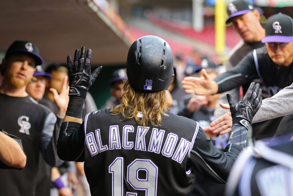 Rampaging Rockies rule the road, roll the Reds