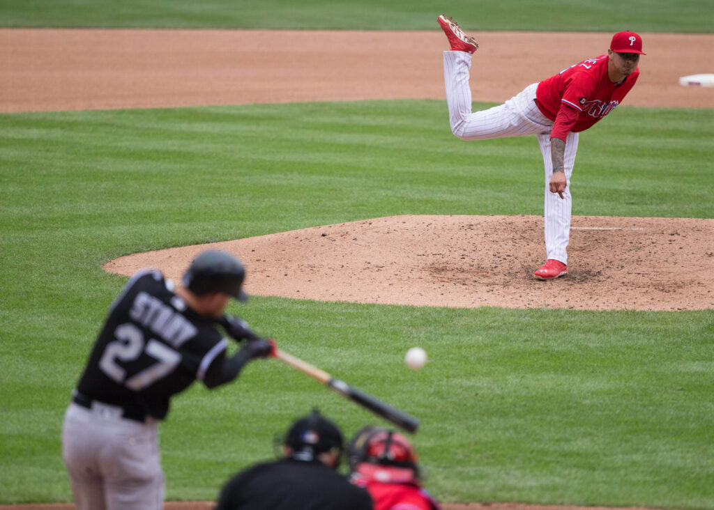 Rockies one-run record undone, Phillies evade sweep in extras