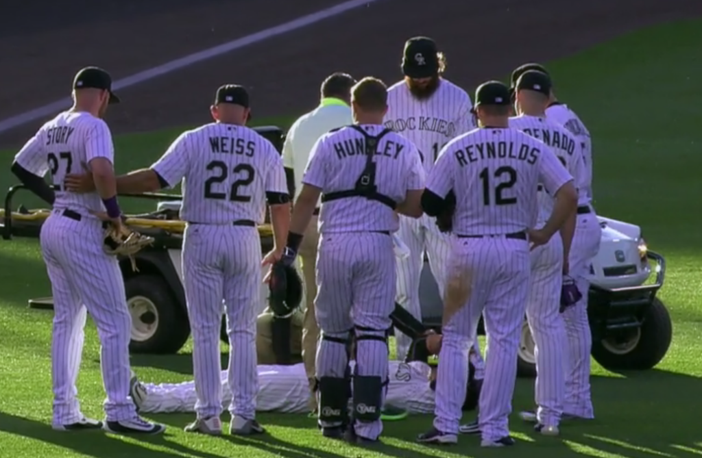 Gerardo Parra carted off field after collision with Trevor Story