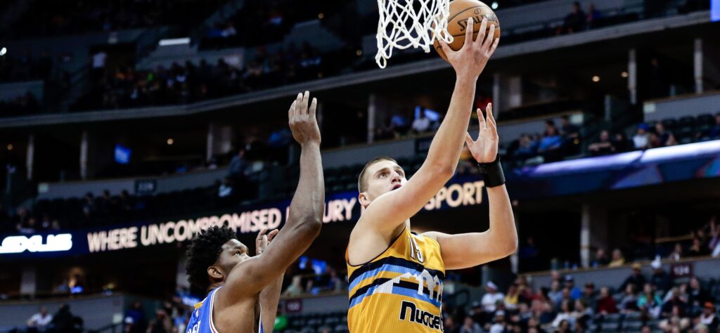 Undermanned 76ers catch fire from three, down Nuggets