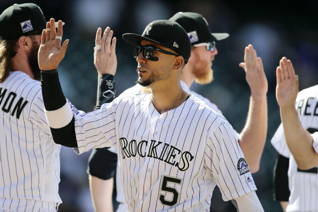 CarGo shines, bullpen slams door in Rockies win