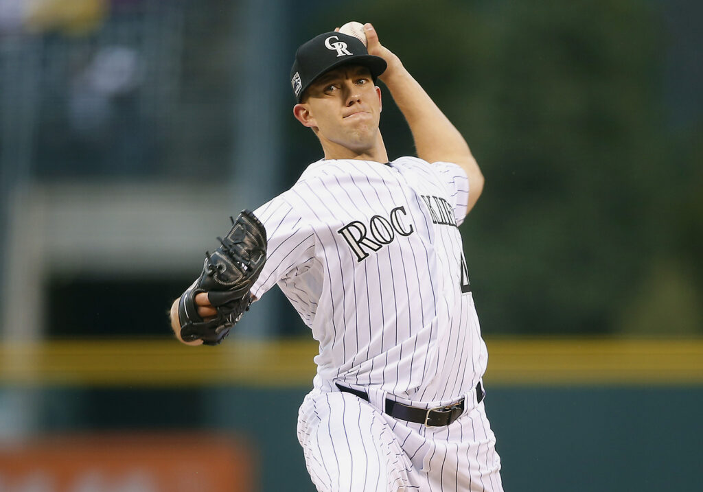 Rox offense springs to life to even series with Cubs