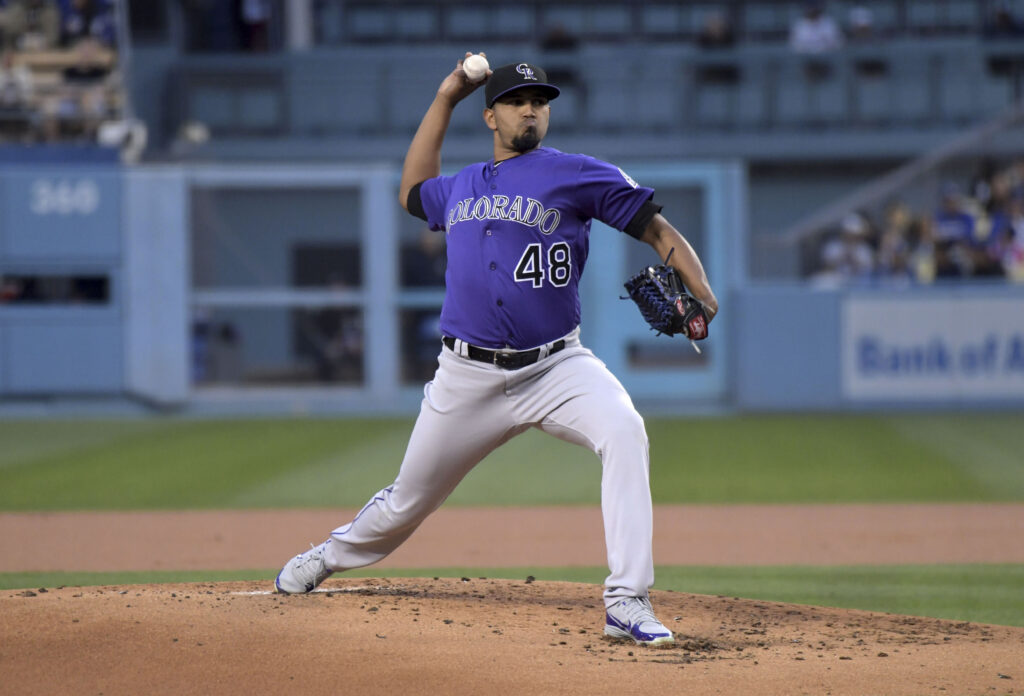 Rockies outlast Dodgers to take first place in NL West