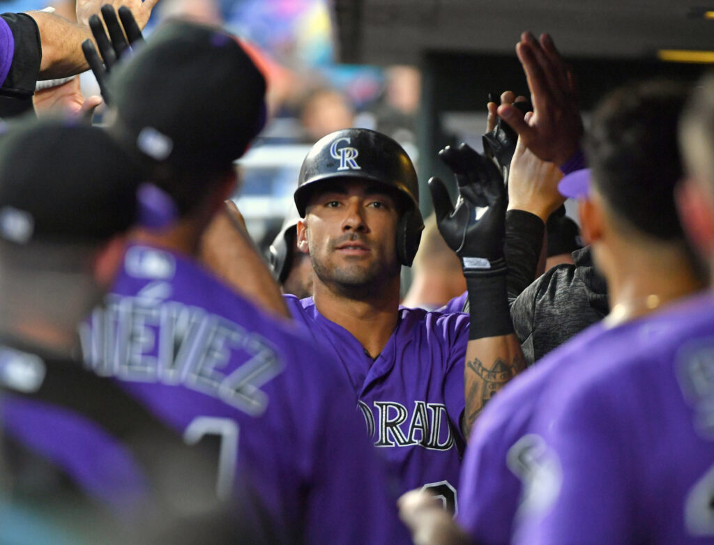 Rockies snap slump with route of Phils