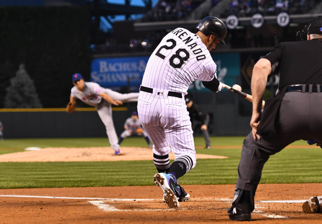 Rockies homer thrice in an inning, hang on late for win over Mets
