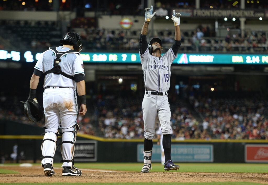 Tapia slams Diamondbacks, Rockies rally to win sixth straight