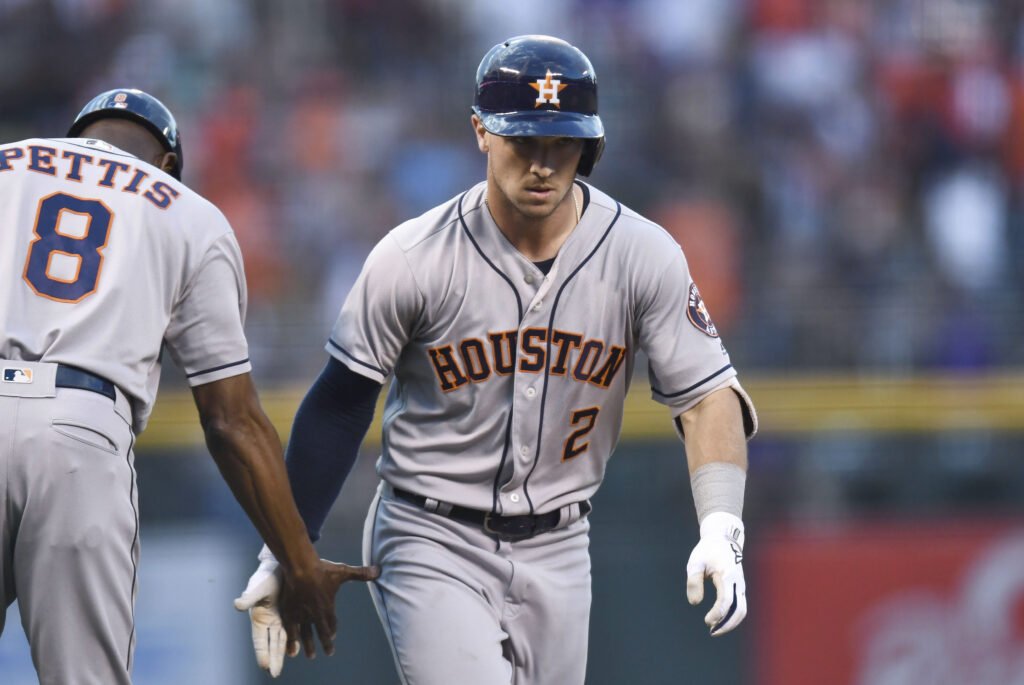 Errors doom Rockies, Astros pull away in extras