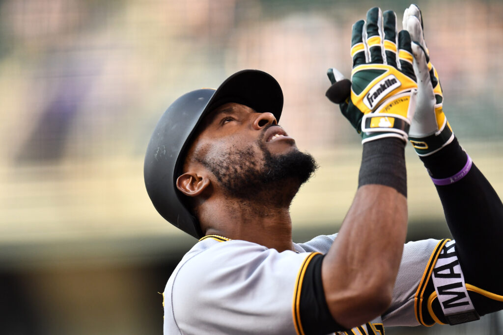 Pirates crush Rockies to even the series