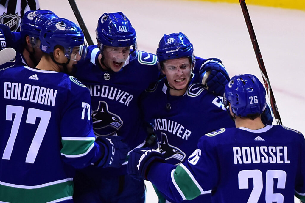 Avalanche blow late lead in wild overtime loss to Canucks