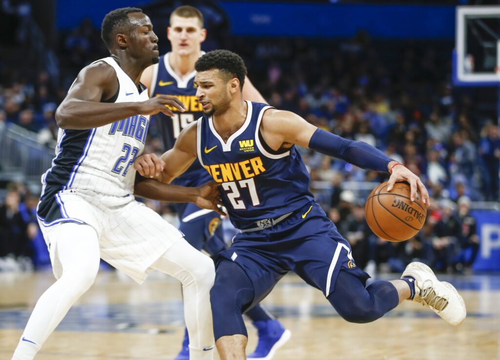 Nuggets slide past hot-shooting Magic in OT to win seventh straight