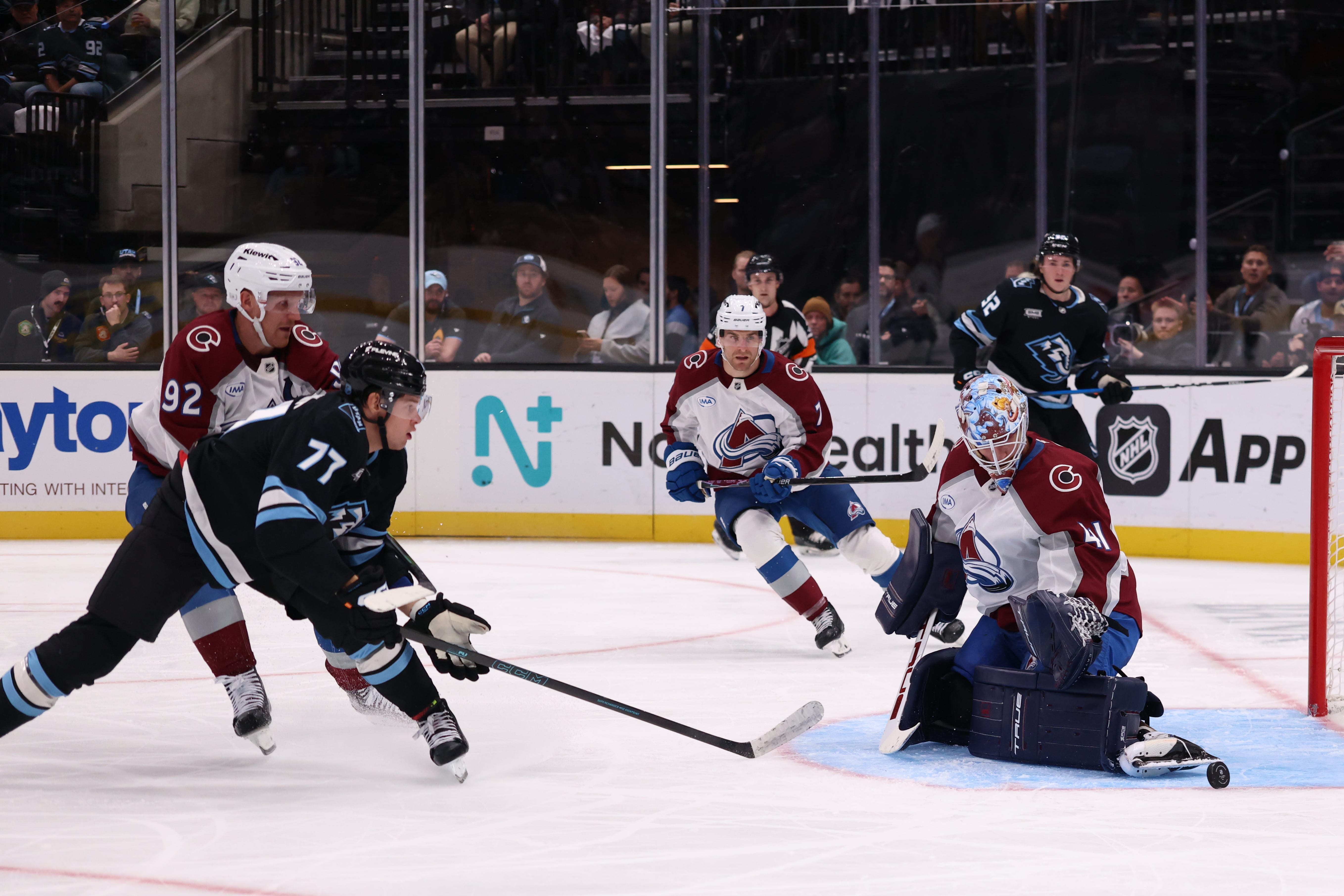 Oct 21, 2025; Salt Lake City, Utah, USA; Colorado Avalanche goaltender Scott Wedgewood (41) blocks a shot by Utah Mammoth right wing JJ Peterka (77) during the third period at Delta Center. Mandatory Credit: Rob Gray-Imagn Images