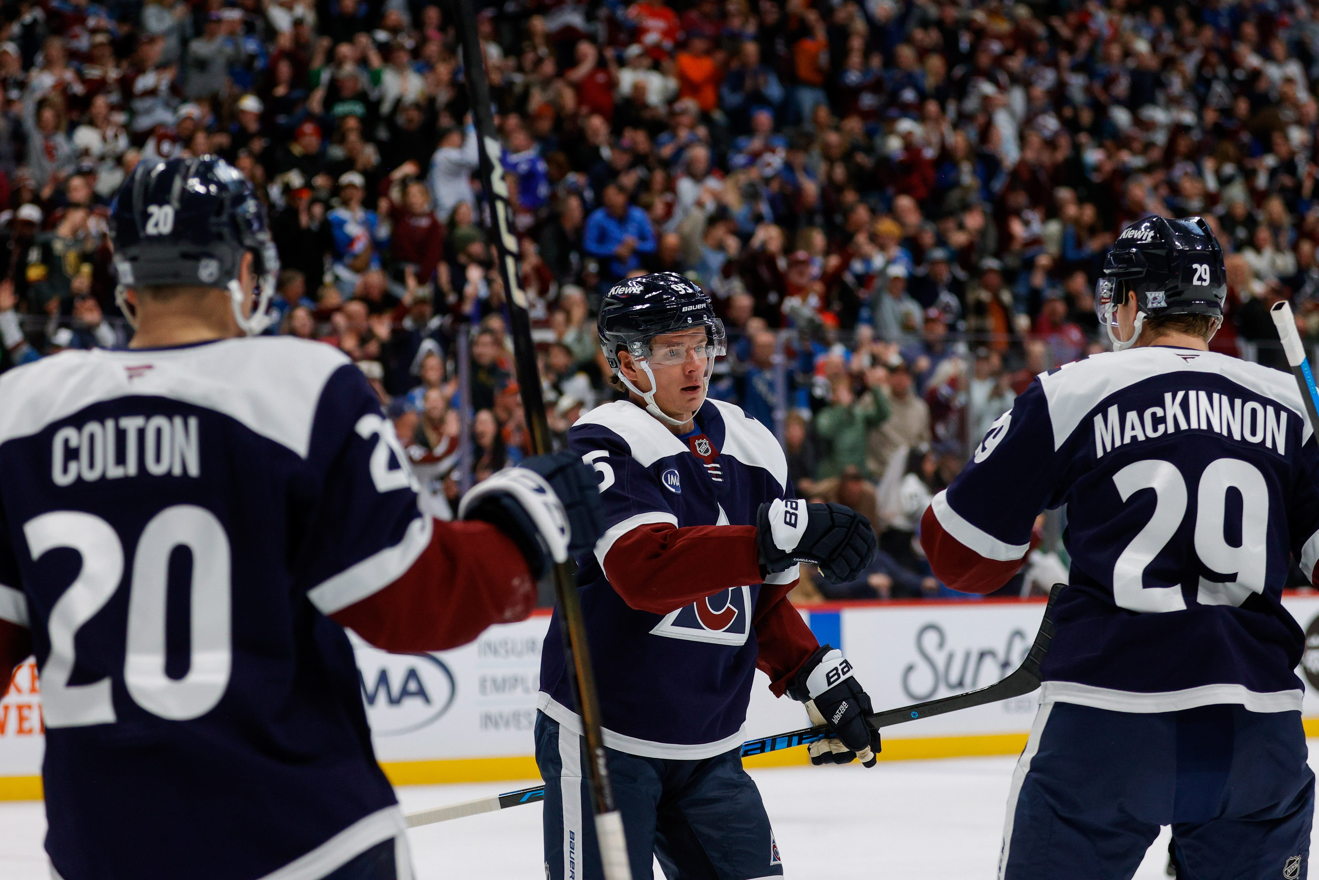 Colorado Avalanche left wing Victor Olofsson (95) celebrates his goal with center Nathan MacKinnon (29) and right wing Ross Colton (20) in the second period against the Nashville Predators at Ball Arena. Mandatory Credit: Isaiah J. Downing-Imagn Images
