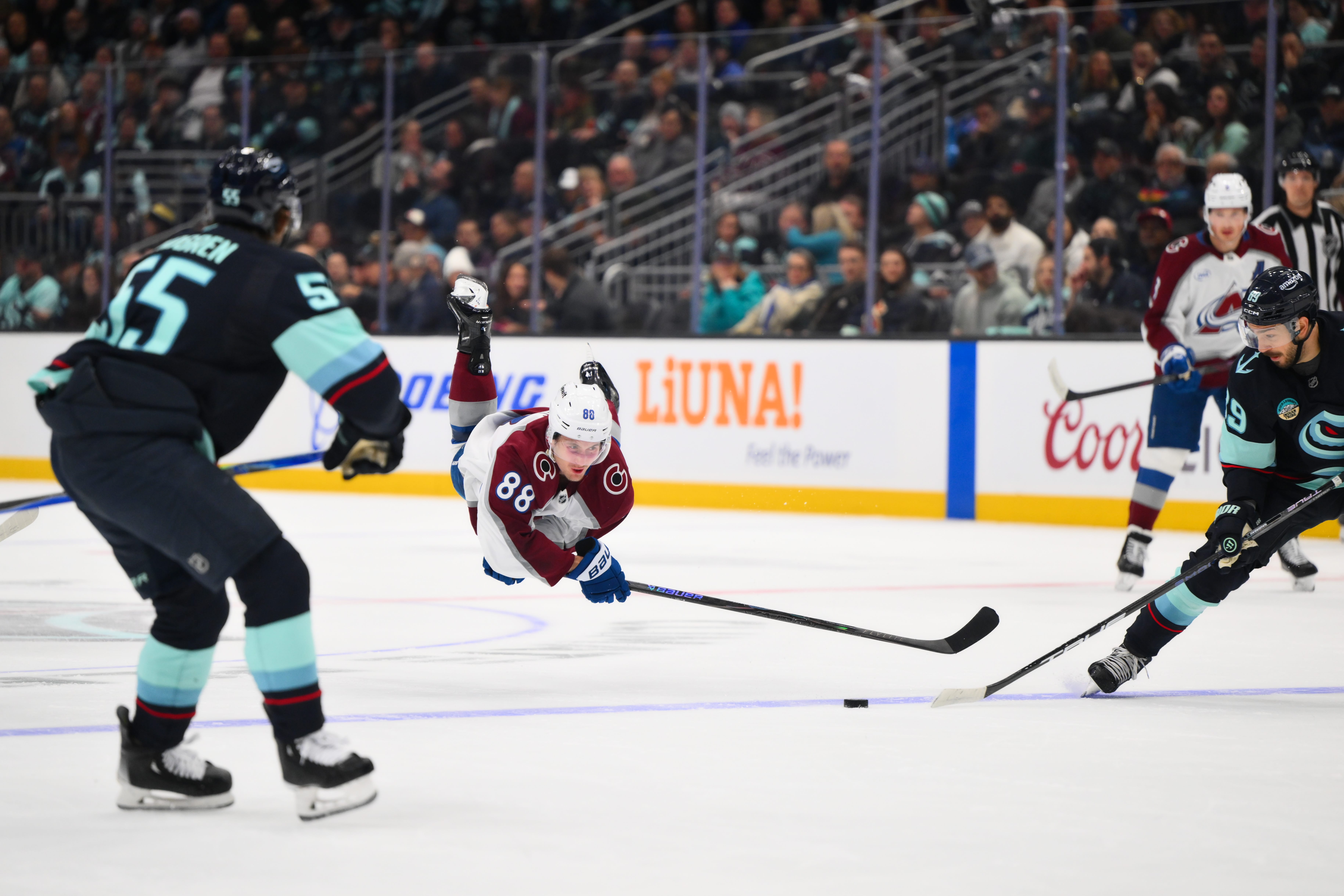 Colorado Avalanche center Martin Necas (88) dives for the puck after being tripped during the first period against the Seattle Kraken at Climate Pledge Arena. Mandatory Credit: Steven Bisig-Imagn Images