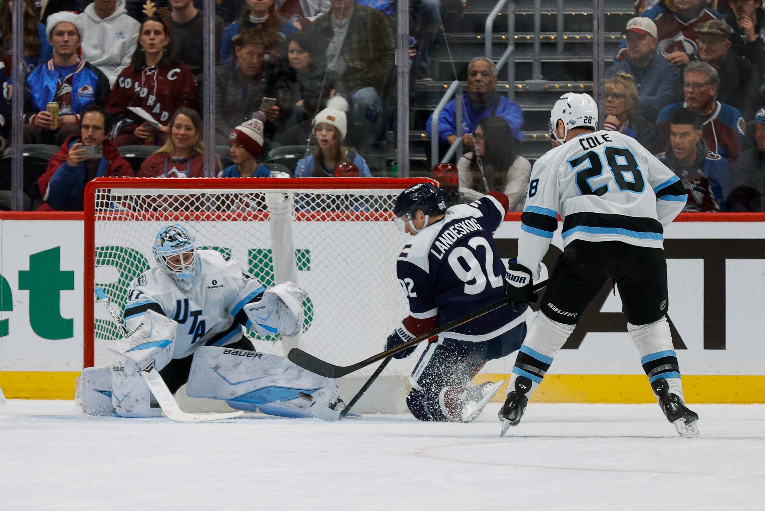 Colorado Avalanche (Avs) left wing Gabriel Landeskog (92) attempts to knock in a rebound against Utah Mammoth goaltender Vitek Vanecek (41) as defenseman Ian Cole (28) defends in the first period at Ball Arena. Mandatory Credit: Isaiah J. Downing-Imagn Images