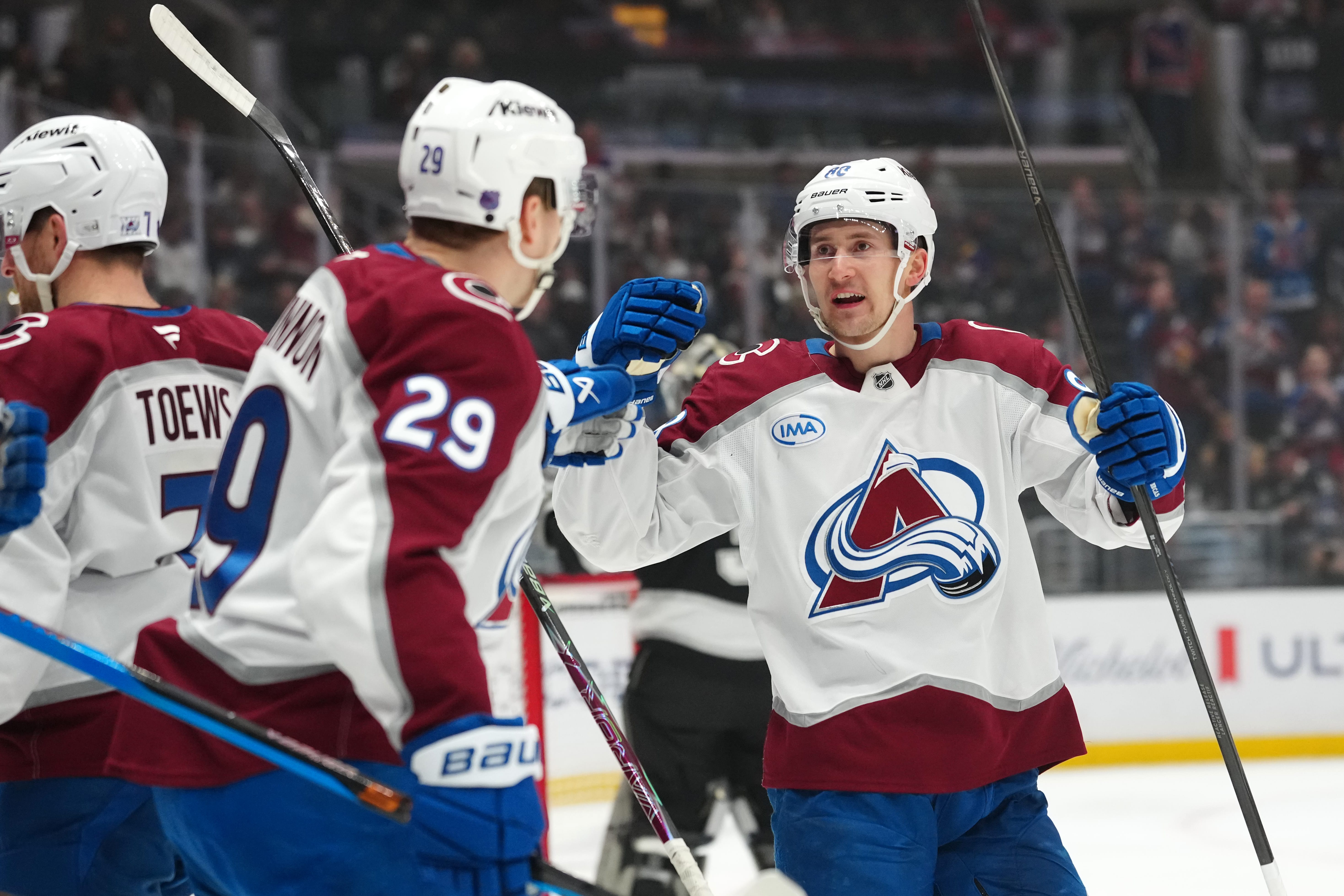 Colorado Avalanche center Martin Necas (88) and center Nathan MacKinnon (29) celebrate after a goal against the LA Kings in the first period at Crypto.com Arena. Mandatory Credit: Kirby Lee-Imagn Images