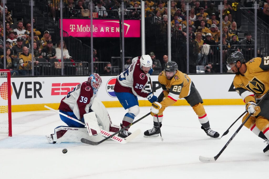 Avs Mackenzie Blackwood making a save on Cole Smith
