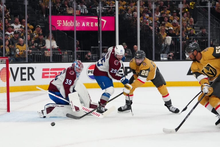 Avs Mackenzie Blackwood making a save on Cole Smith