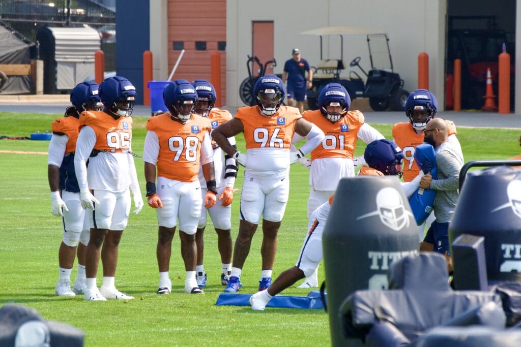 Denver Broncos' defensive line participating in drills during training camp. Photo credit: Ryan Greene