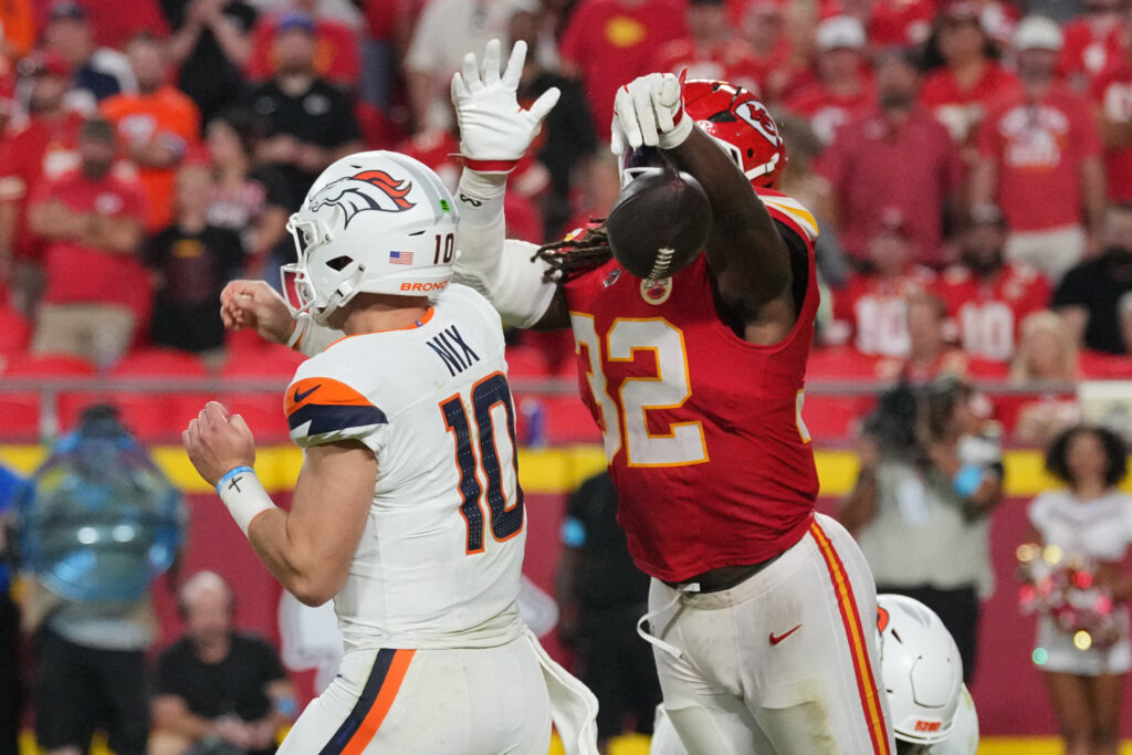 Sep 14, 2026; Kansas City, Missouri, USA; Kansas City Chiefs linebacker Nick Bolton (32) blocks the pass from Denver Broncos quarterback Bo Nix (10) at GEHA Field at Arrowhead Stadium. Mandatory Credit: Denny Medley-Imagn Images