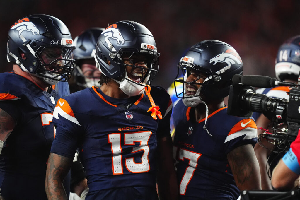 Sep 27, 2026; Denver, Colorado, USA; Denver Broncos wide receiver Pat Bryant (13) celebrates with wide receiver Jaylen Waddle (17) after a two-point conversion against the Los Angeles Rams during the second half at Empower Field at Mile High. Mandatory Credit: Ron Chenoy-Imagn Images
