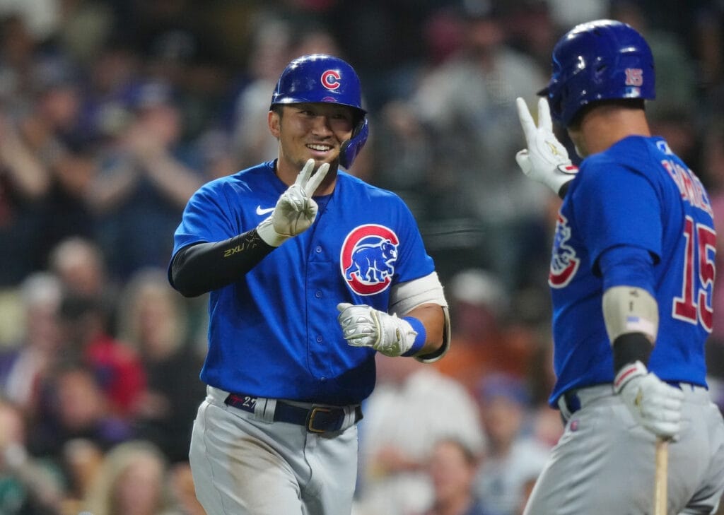 Chicago Cubs right fielder Seiya Suzuki celebrates his two-run home run with catcher Yan Gomes.