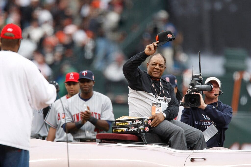 Willie Mays takes a seat to go around the field in a 1958 Cadillac Eldorado on July 8, 2007.