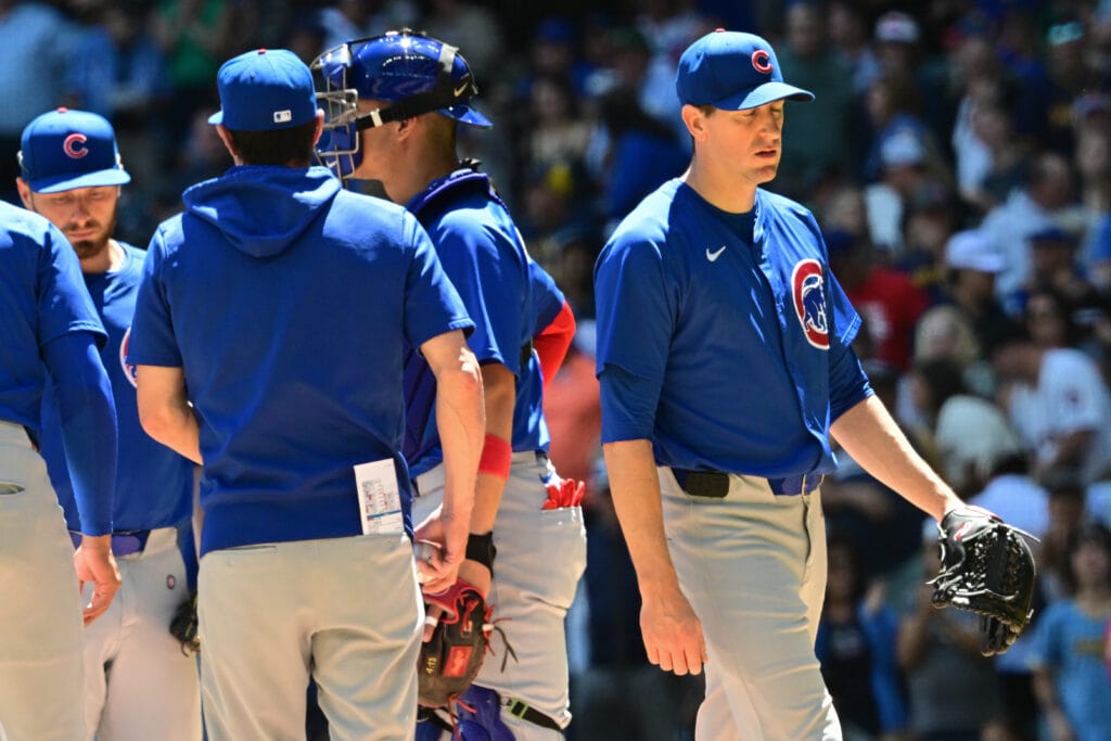 Chicago Cubs starting pitcher Kyle Hendricks (28) walks off the mound during a pitching change after giving up seven runs in the fourth inning against the Milwaukee Brewers at American Family Field.