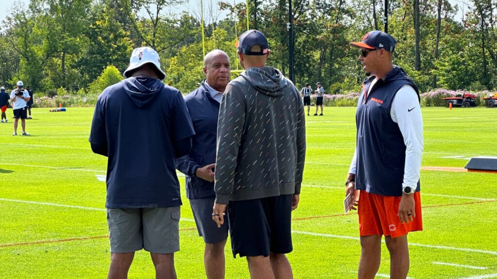 Ian Cunningham, Kevin Warren, Ted Banks, and Ryan Poles meet on sideline of Bears training camp