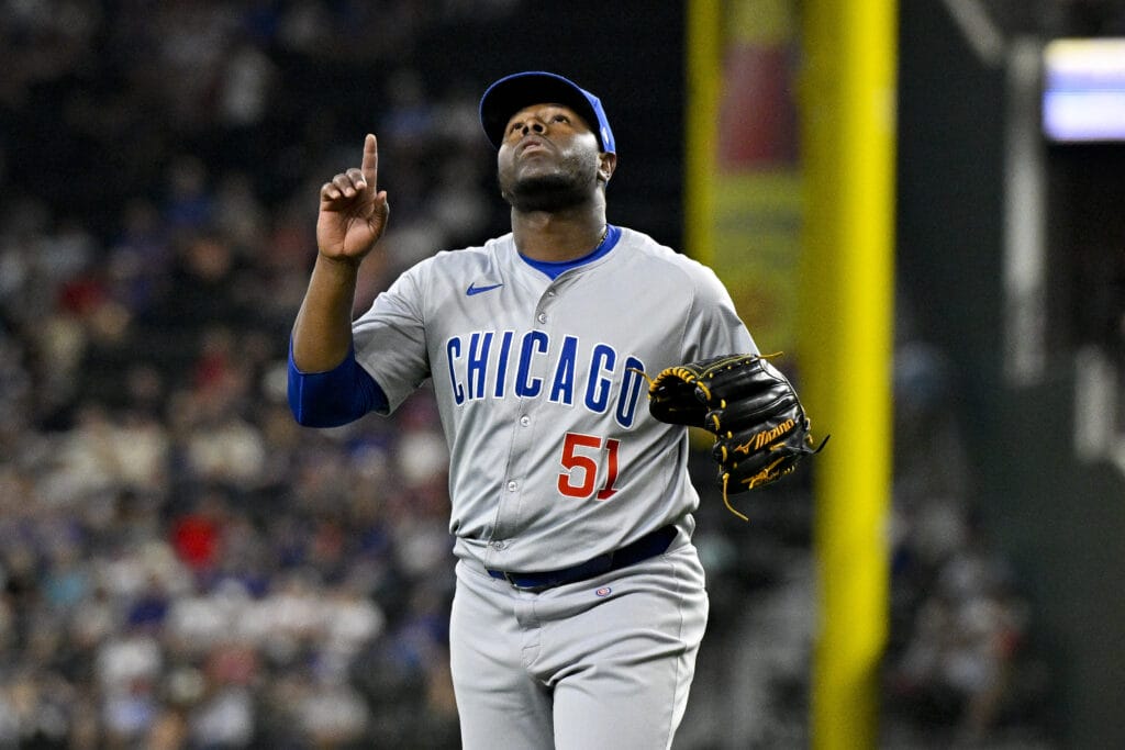 Chicago Cubs relief pitcher Héctor Neris (51) celebrates as he comes off the field after pitching against the Texas Rangers during the eighth inning at Globe Life Field.