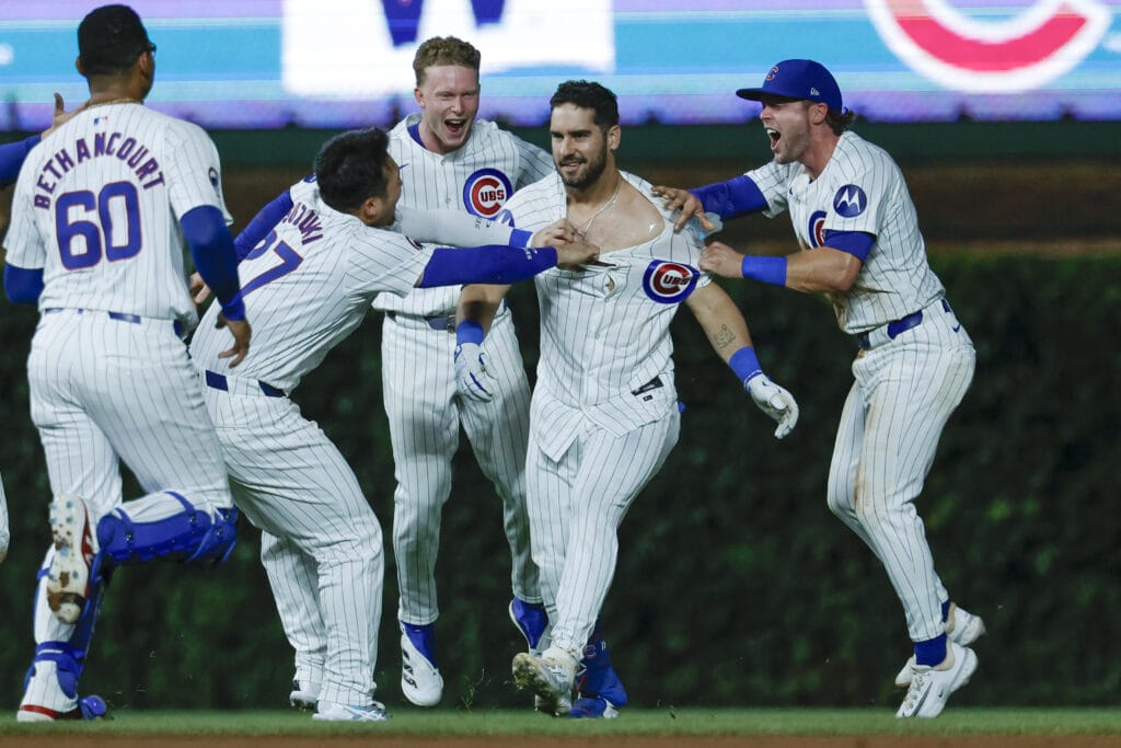 Chicago Cubs outfielder Mike Tauchman (40) celebrates with teammates his walk-off single against the St. Louis Cardinals during the ninth inning at Wrigley Field.