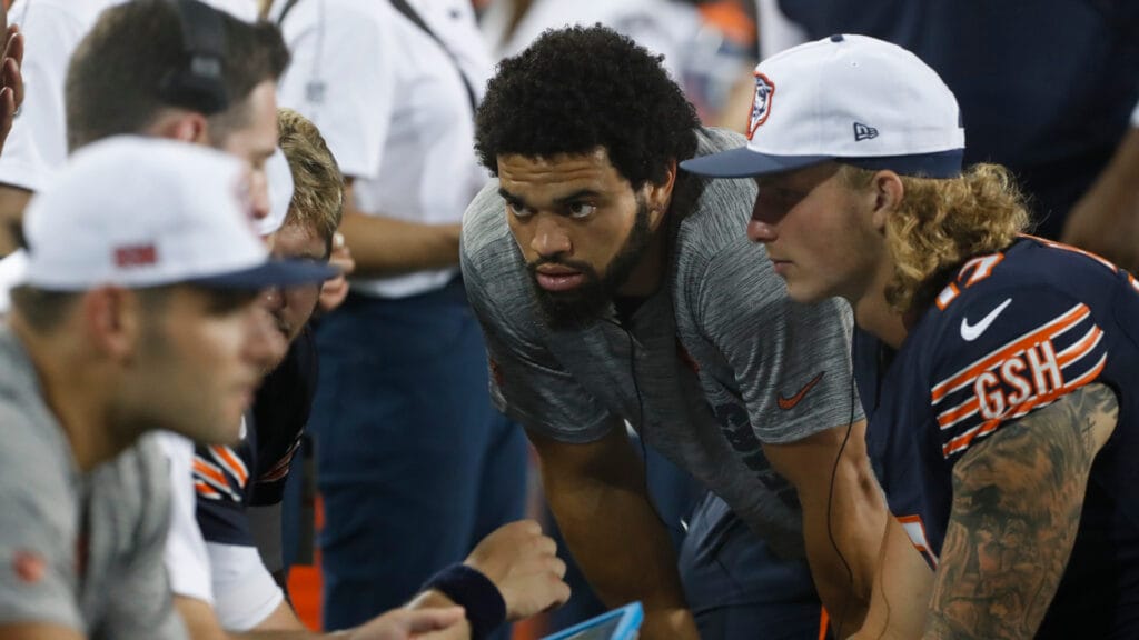 Bears QBs Caleb Williams and Tyson Bagent huddle on the sideline at the Hall of Fame Game.
