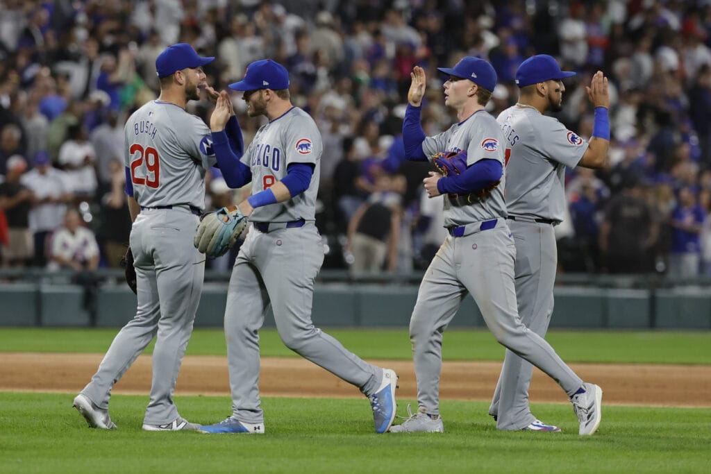 Chicago Cubs players celebrate after defeating the Chicago White Sox at Guaranteed Rate Field.
