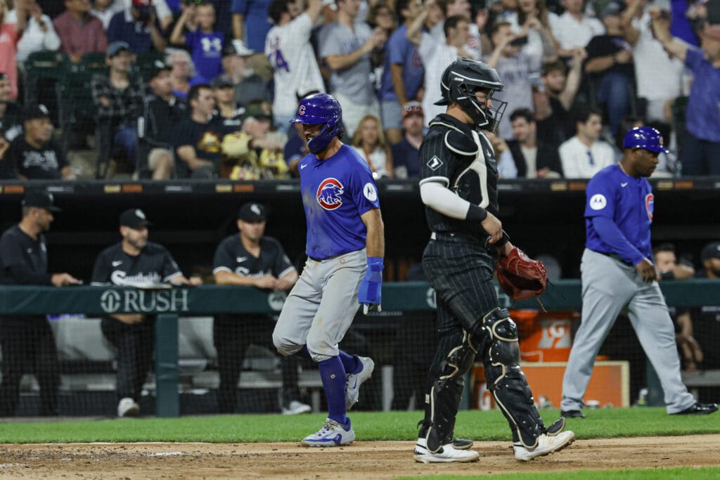 Chicago Cubs shortstop Dansby Swanson (7) scores against the Chicago White Sox during the eight inning at Guaranteed Rate Field.