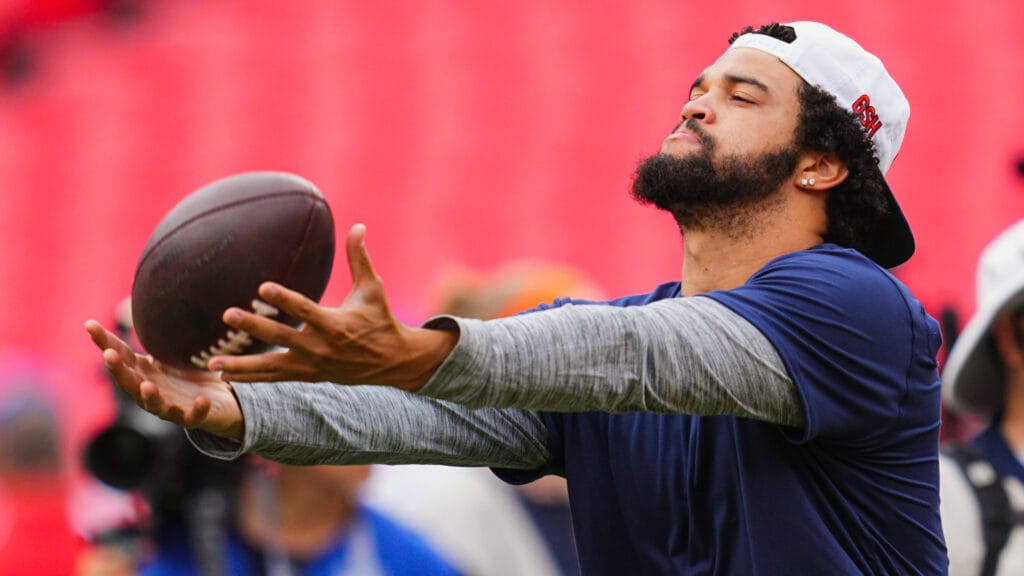 Bears QB Caleb Williams catching a ball during warmups against the Chiefs