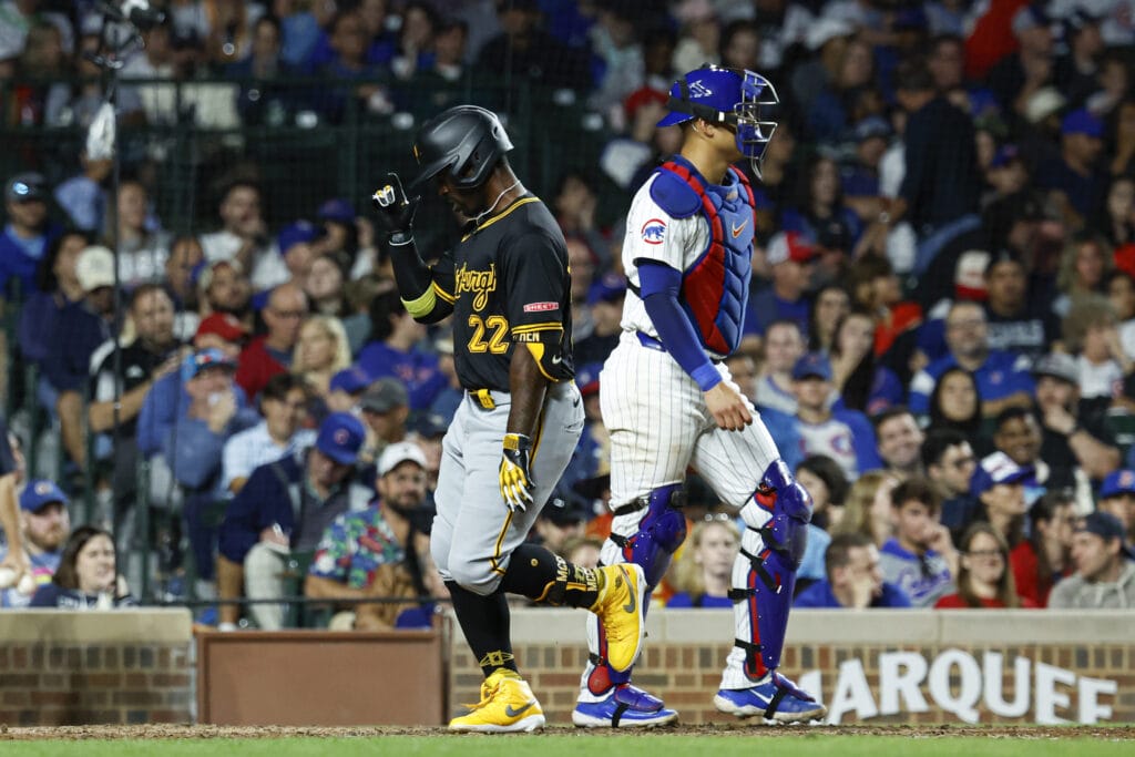 Pittsburgh Pirates outfielder Andrew McCutchen (22) crosses home plate after hitting a solo home run against the Chicago Cubs during the eight inning at Wrigley Field.