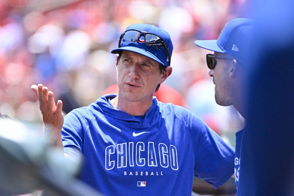 Chicago Cubs manager Craig Counsell (30) looks on from the dugout before a game against the St. Louis Cardinals at Busch Stadium.