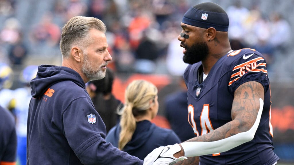 Chicago Bears head coach Matt Eberflus embraces Marcedes Lewis