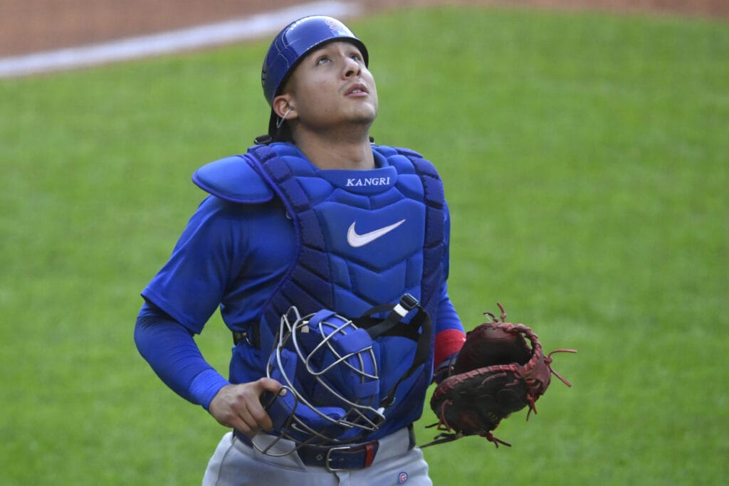 Chicago Cubs catcher Miguel Amaya (9) looks for a foul ball in the second inning against the Cleveland Guardians at Progressive Field.
