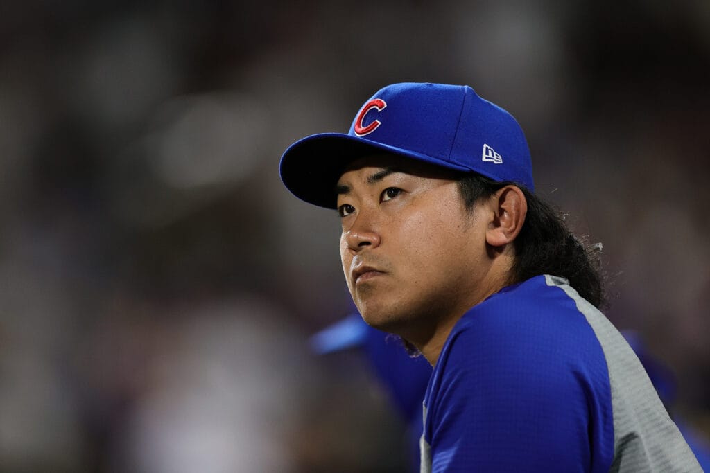 Pitcher Shota Imanaga (18), a major Chicago Cubs starting pitching piece, looks on in the eighth inning against the Colorado Rockies at Coors Field.