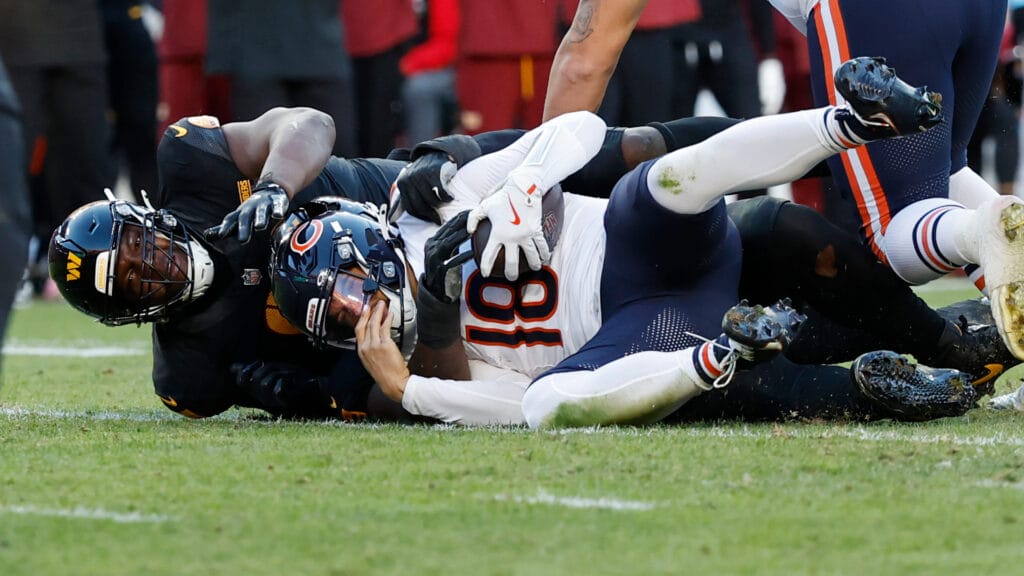 Bears quarterback Caleb Williams sacked.