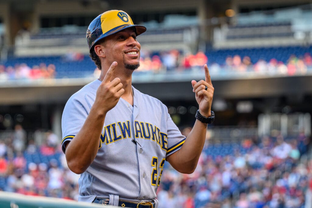 Milwaukee Brewers first base coach Quintin Berry (23) reacts to fans prior to the game between the Washington Nationals and the Milwaukee Brewers at Nationals Park.