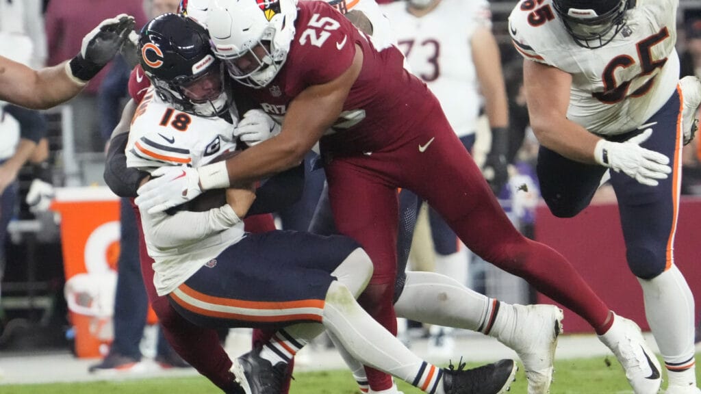Chicago Bears quarterback Caleb Williams is sacked by an Arizona Cardinals defender.