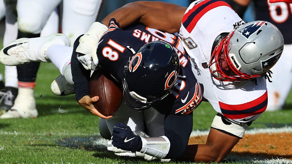 Chicago Bears quarterback Caleb Williams absorbs a sack