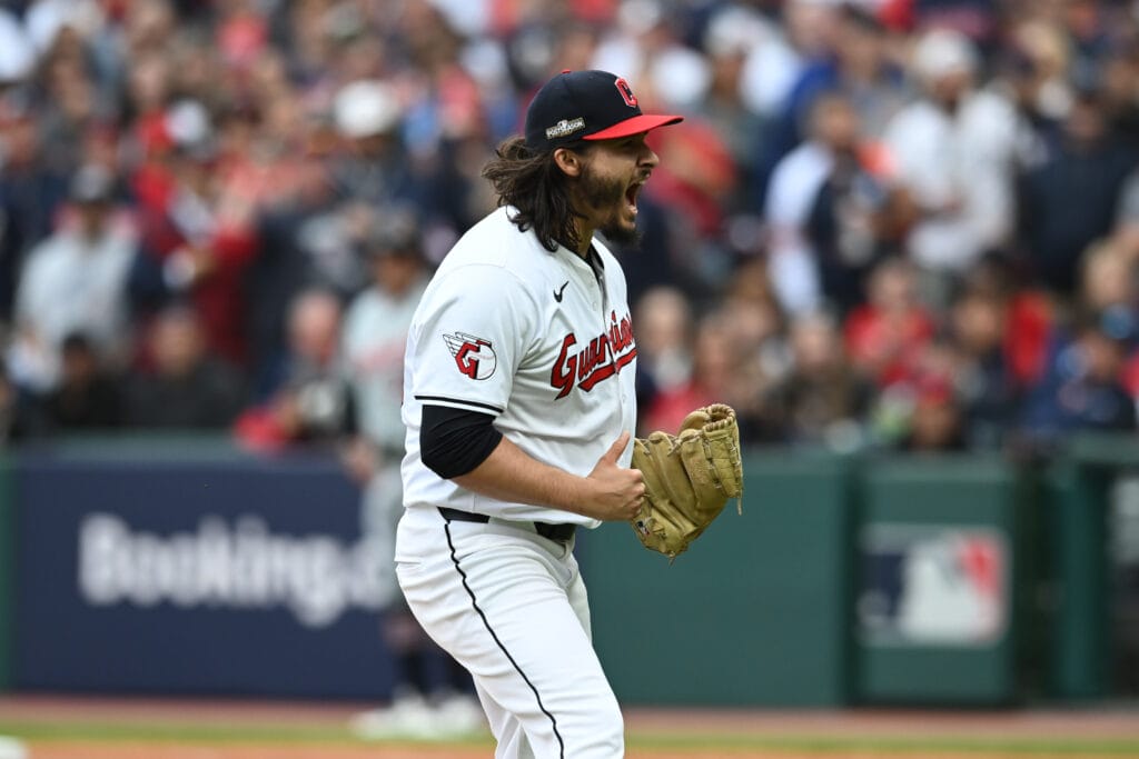 Cleveland Guardians pitcher Eli Morgan (49) celebrates after a strike out in the seventh inning against the Detroit Tigers during game five of the ALDS for the 2024 MLB Playoffs at Progressive Field. He was recently added to the Cubs' bullpen.