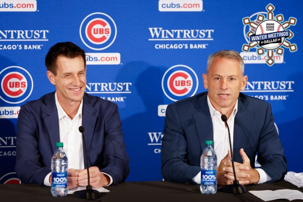 Craig Counsell (L) smiles as he is introduced by Jed Hoyer (R), Cubs President of baseball operations as a new Cubs manager during a press conference in Chicago. What did we learn about the Cubs at the Winter Meetings?