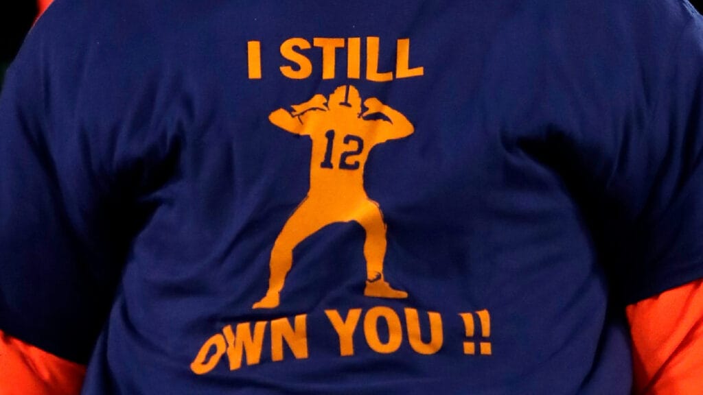 A fan wears an 'I Still Own You' t-shirt in Green Bay.