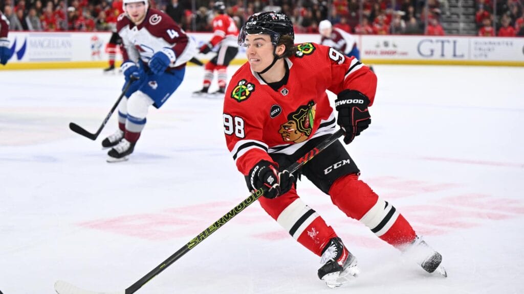 Dec 19, 2023; Chicago, Illinois, USA; Chicago Blackhawks forward Connor Bedard (98) controls the puck in the first period against the Colorado Avalanche at United Center.